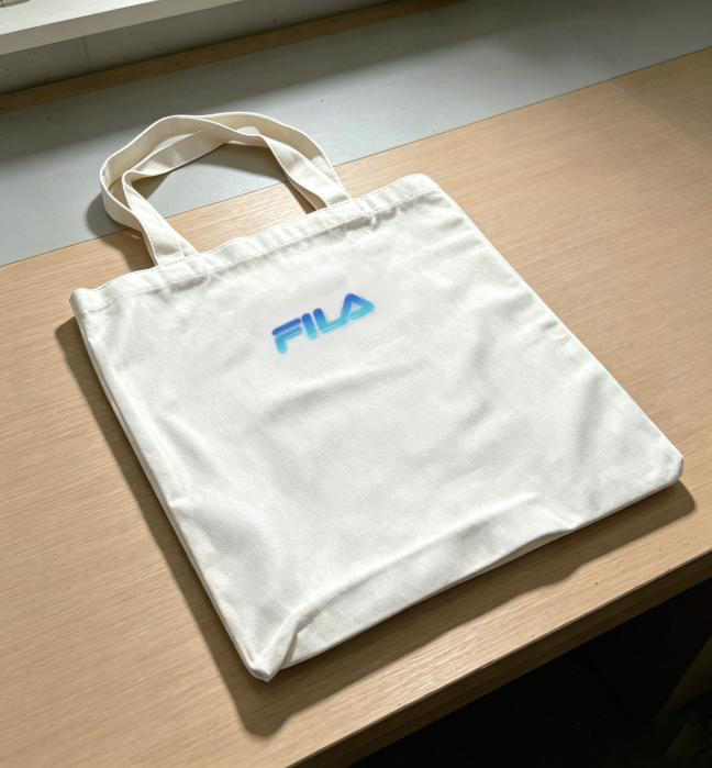 Cream canvas tote with a colourful logo, shown in the GD-302UV manufacturer brochure.